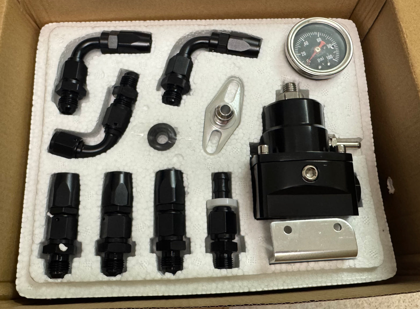 Fuel pressure regulator with fittings